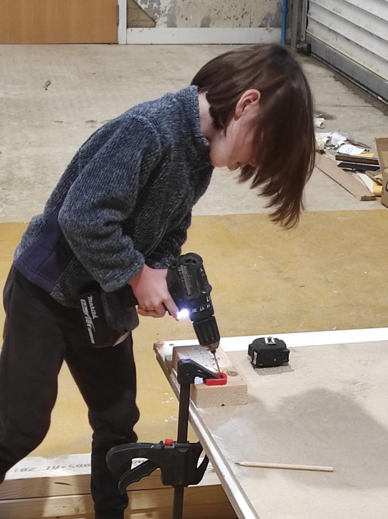 Elis using a drill.jpg